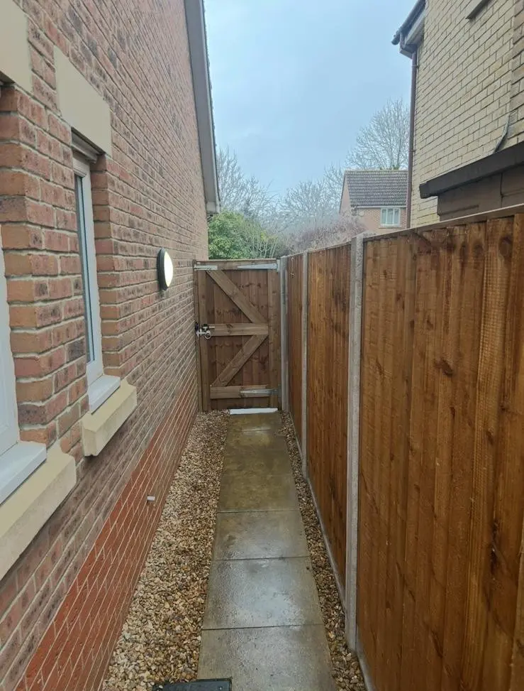 Solid Feather Edge Close Board Fencing with Gate